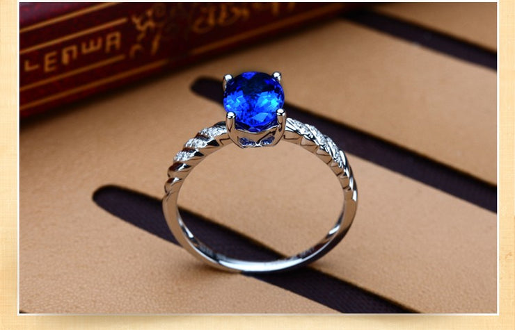 1 Carat Sapphire and Moissanite Diamond Halo Engagement Ring in White Gold