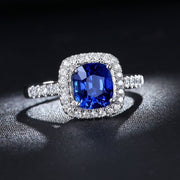 2 Carat Classic oval cut Sapphire and Moissanite Diamond Halo Engagement Ring in White Gold