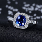 2 Carat Classic oval cut Sapphire and Moissanite Diamond Halo Engagement Ring in White Gold