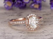 Classic Oval Cut 1.50 Ct Moissanite and Diamond Halo Wedding Ring in Rose Gold
