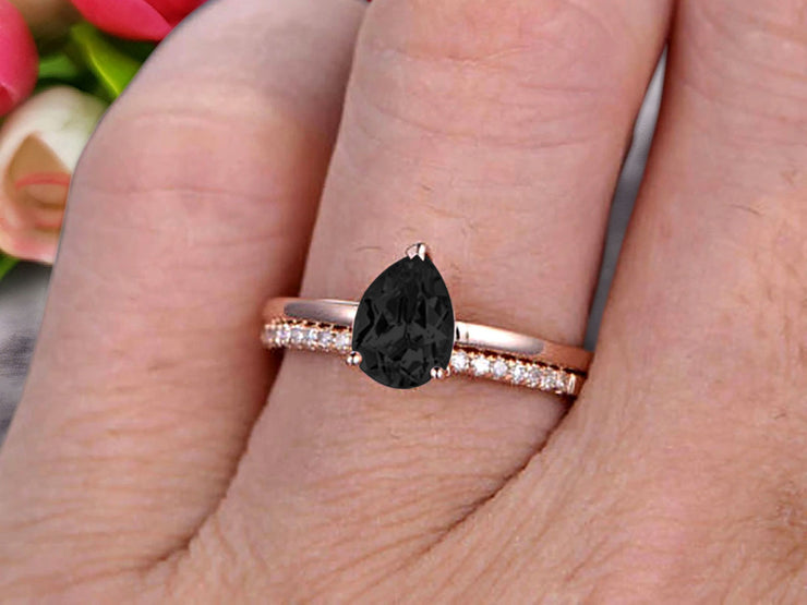 1.25 Carat Solitaire Pear Shape Black Diamond Moissanite Engagement Ring With Matching Wedding Band On 10k Rose Gold Bridal Ring Set Surprisingly