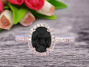 1.50 Carat Oval Cut Black Diamond Moissanite Halo Engagement Ring on 10k Rose Gold 