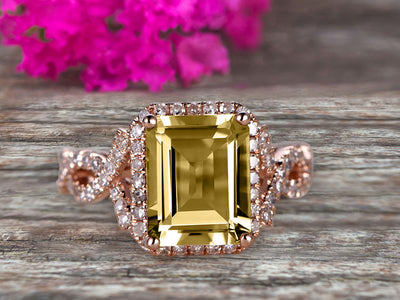 1.50 Carat Emerald Cut Champagne Diamond Moissanite Engagement Ring 10k Rose Gold Promise Ring for Bride or Anniversary Gift Startling Jewelry Twisted Across Design Halo Art Deco