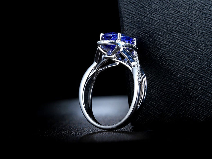 Inexpensive 1.50 Carat Blue Sapphire and Moissanite Diamond Infinity Engagement Ring in White Gold