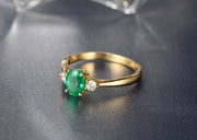 Trilogy Half Carat oval cut Emerald and Round Moissanite Diamond Engagement Ring in Yellow Gold