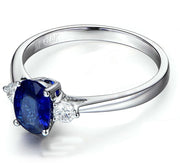 Trilogy Half Carat oval cut Sapphire and Round Moissanite Diamond Engagement Ring in White Gold